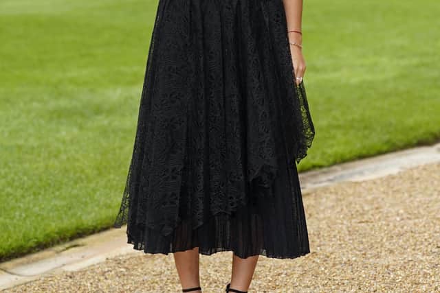 The £5,300 ‘Asymmetric Mid-Length Dress’ from Dior was complete with frilly shoulders, lacy overlay and a chunky belt with a tiny Dior saddlebag attached, as seen throughout the brand’s Resort 2023 collection. The ‘Diorodeo’ hat and ‘Idylle’ pumps complete the look.