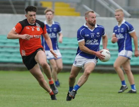 Stephen Conneely gets away from James Lalor.