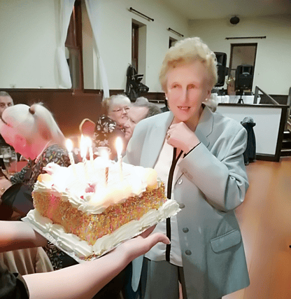 Annie Keeley receiving her birthday cake. Annie has made an enormous contribution to READY