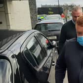 Declan Haughney (front, wearing mask) arrives at Kilkenny Courthouse this morning