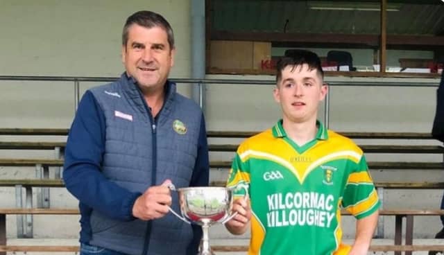 K/K captain, Lochlann Kavanagh receives the U-20 HC Cup from County Board Chairman Michael Duignan