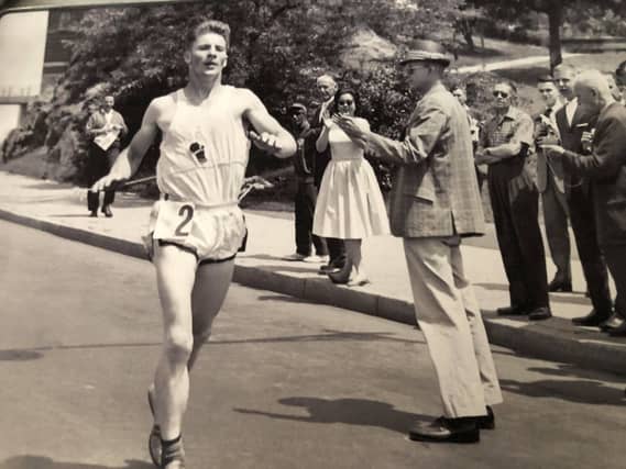 Colman Mooney breaks the tape to win the Winter Series Four Mile Run in New York in 1962