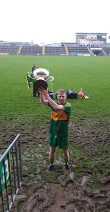 Niall Darby, displaying the Dowling Cup. Picture: Rhode GAA facebook.