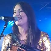 Olivia on stage at the Country Comes Together Christmas concert recently (photo credit, Debra Dowler)
