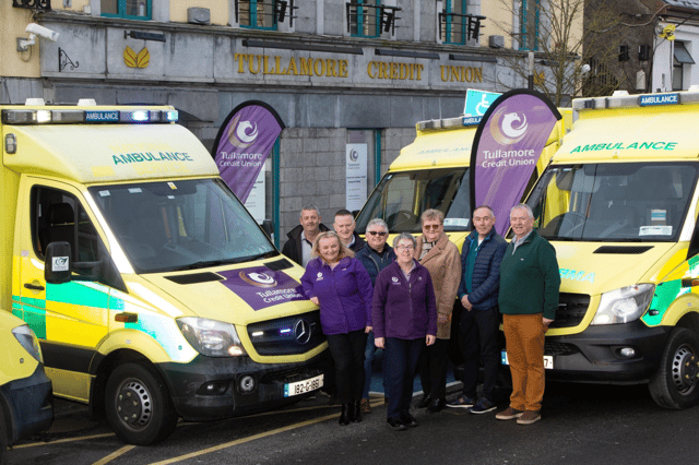 Michael Murphy, Tom Doyle and the team at Tullamore Credit Union with two of the ambulances