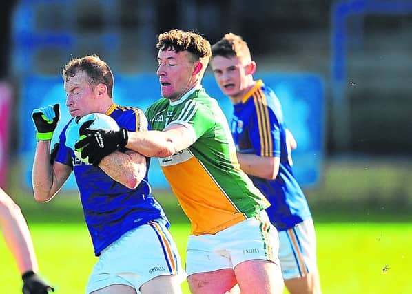 Longford's Padraig McCormack in action against Offaly's William Mulhall in tonight's Bord na Móna O'Byrne Cup match in Newtowncashel. Photo by Declan Gilmore