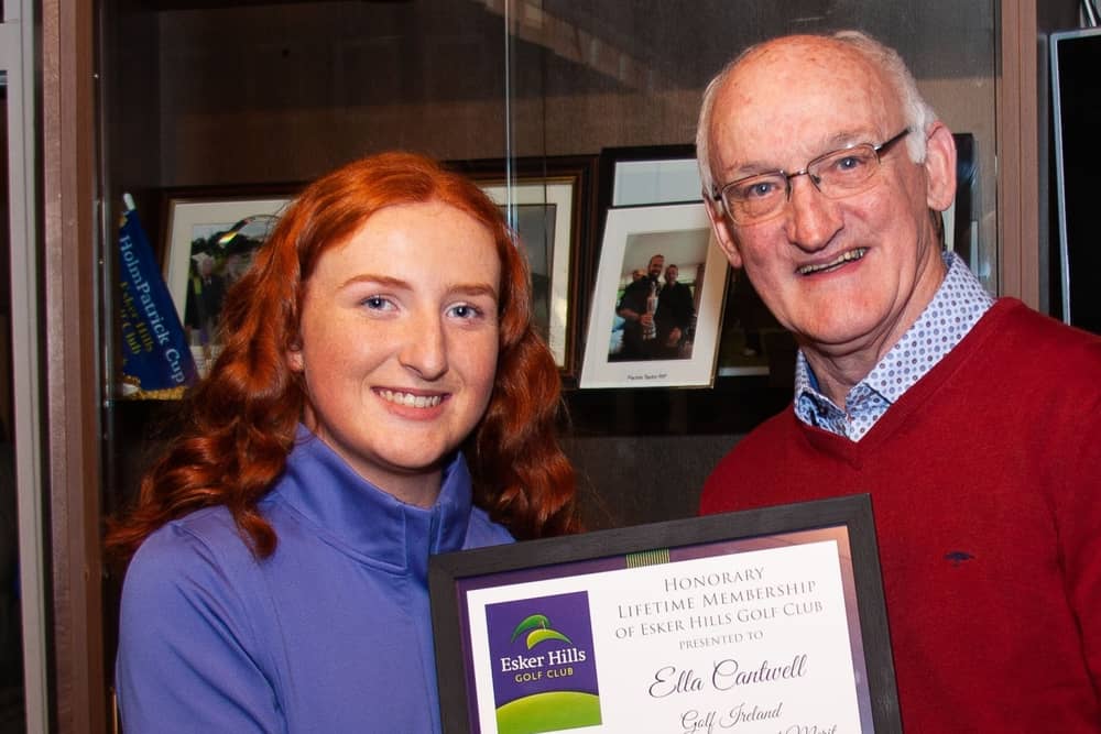 Ella Cantwell receiving life membership from Ray Molloy at Esker Hills Golf Club last year