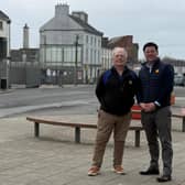Deputy John Clendennen and Cllr Noel Cribbin with the site of the new Edenderry library in the background