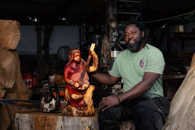 Paradzai with one of his wonderful wood carvings