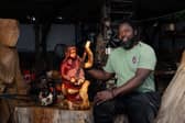 Paradzai with one of his wonderful wood carvings