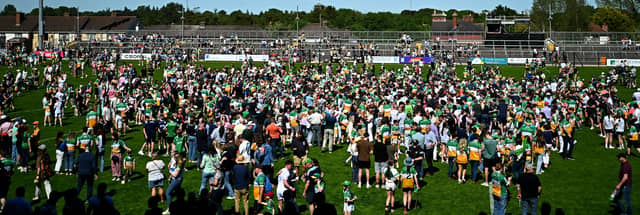Offaly fans celebrate with players in Newbridge on Sunday