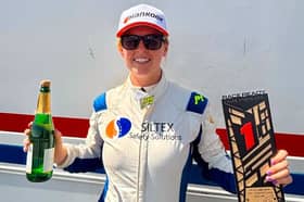 Nicole celebrates on the podium in Spain