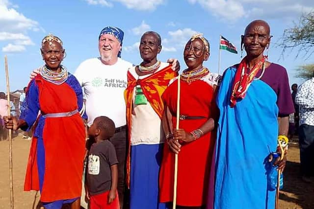 Ronan Scully of Self Help Africa with some village Women Elders in a Massai village in Baringo County in Kenyain Africa recently