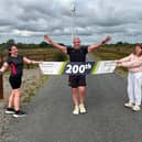Gareth with his two daughters celebrate his 200th parkrun