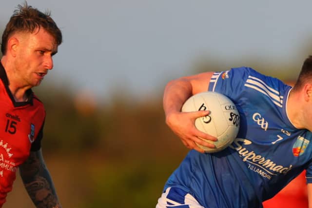 Patrick Fahey gets away from Ciaran McGuinness
