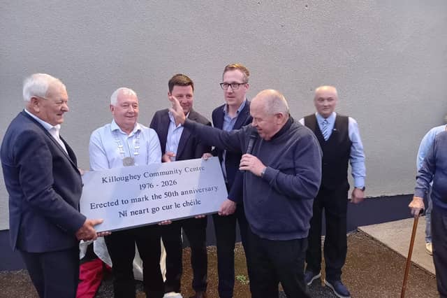 The first and current Chairpersons of Killoughey Community Centre Michael Mahon and Cllr Neil Feighery pictured at the commemorative plaque's blessing by Kilcormac Killoughey Parish Priest Fr. Michael Meade, Cathaoirleach of Offaly County Council, Cllr Declan Harvey, Deputy John Clendennen and Paddy Keating