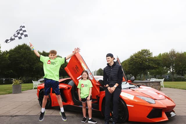 Irish Formula 2 racing driver Alex Dunne pictured with Phoebe Quail (7) and Jimmie Quail (10) at the announcement that Ronald McDonald House will be the official charity partner