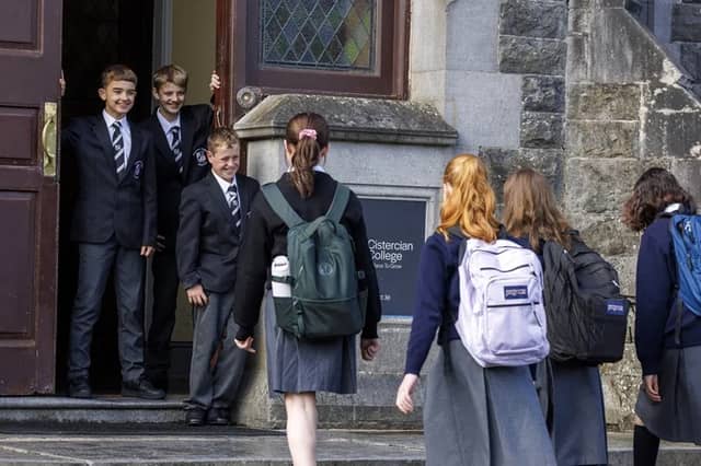 Harry Rymer from Roscrea, Ewan Kennedy from Portumna and Jack Cleary from Drom-and-Inch welcoming first year girls. Photo: Arthur Ellis