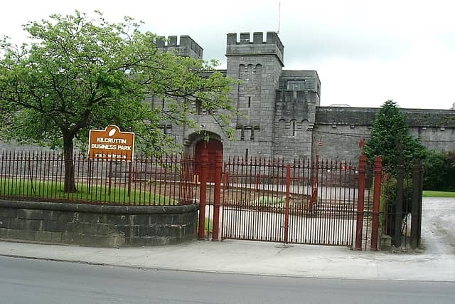 1. On Cormac Street is the Gothic-style facade of the old county jail, now Kilcruttin Business Park. The iron work to the front of the gaol and courthouse dates from 1835. At the jail entrance gates may be seen the Roman symbols of authority, the fasces, a bundle of rods from which an axe projected. Courtesy of Offaly History Archives.