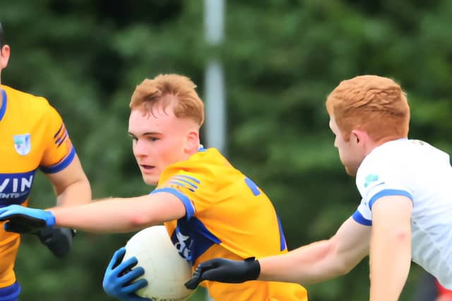 Conor Daly is tackled by Tommy Leavy with Jamie Cornally in support