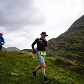​George Webb (left) and John Bulfin crossing the magnificent pass at the head of the remote Black Valley on the Kerry Way. A 200 kilometre run through the mountains of Kerry is one of the most daunting challenges imaginable.