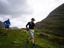 ​George Webb (left) and John Bulfin crossing the magnificent pass at the head of the remote Black Valley on the Kerry Way. A 200 kilometre run through the mountains of Kerry is one of the most daunting challenges imaginable.