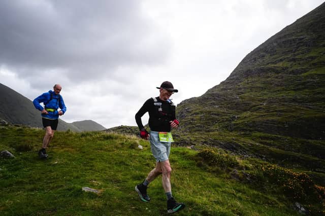 George Webb (left) and John Bulfin crossing the magnificent pass at the head of the remote Black Valley on the Kerry Way. A 200 kilometre run through the mountains of Kerry is one of the most daunting challenges imaginable.