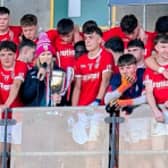 Edenderry captain Ruari Carroll about to be presented with the MFC Cup by Offaly GAA’s Niamh Clarke