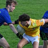  Deasun McNamee holds onto the ball for St Vincent's despite the best efforts of Barry Bradly and Jack McGuinness 