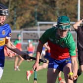 Cillian Moran grabs the ball ahead of Gavin Deverty