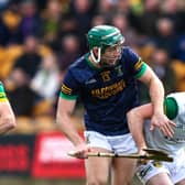 Thomas Geraghy is tackled by Ross Ravenhill and Cian Kinnarney