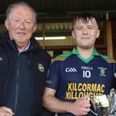 Tom Parlon presents the Jimmy Hogan cup to Kilcormac Killoughey captain Aaron O'Kelly with Edel Hogan-Hoctor 
