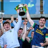Jordan Quinn of Kilcormac-Killoughey lifts the Sean Robbins Cup alongside teammate Charlie Mitchell after the Offaly County Senior Club Hurling Championship final. 