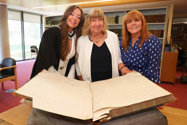 Hannah Clarke, her grandmother Margaret Moloney and mother Anne Clarke with the University of Galway student register, showing the signature of Hannah’s great-grandmother, Mary C. Whyte. 