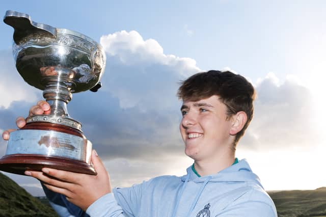 Eanna Mulhare proudly displays the trophy