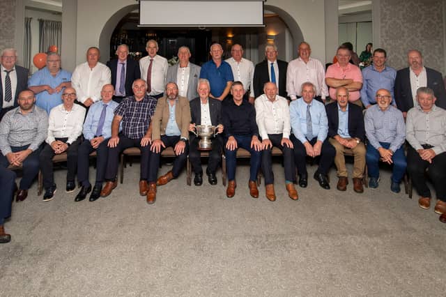 The Tubber 1986 Team and Management: Front Row L to R: Dinny Wynne, Brendan Heavin (representing Pat Egan, absent), Ned Daly, Eddie Rafferty, Joe Lowry, Martin Heavin, John Rafferty, Pat Doolin, Sylvester Nestor, Joe Higgins, Declan Fox, Chris Daly, JJ Colgan, Chris Nestor Back Row L to R: Lynette Rafferty (representing Tom Rafferty, absent), Oliver McManus, James Higgins (representing Kevin Higgins, RIP), Willie Colgan, TJ Kelly, Cormac Kelly, Paddy Sheridan, Padraig Farrell, Aidan King, Eamon Kavangh, John Moran, Tommy Colgan, Noel Robbins, Joey Grennan, Pat Egan, David Moran (representing Padraig Moran, RIP)