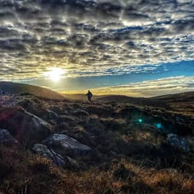 Ronan climbing Diamond Hill on a summer's evening 