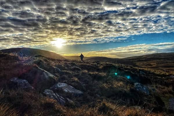Ronan climbing Diamond Hill on a summer's evening 