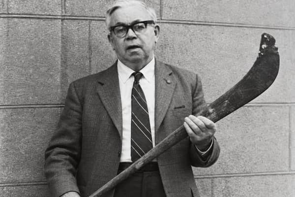 Harry Fennell, holding the Shinrone Hurl made by his father Martin for his teammate Bill Barry. The Hurl will once again take to the field at the community fundraiser walk on Sunday 1st November