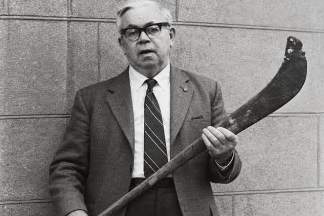 Harry Fennell, holding the Shinrone Hurl made by his father Martin for his teammate Bill Barry. The Hurl will once again take to the field at the community fundraiser walk on Sunday 1st November