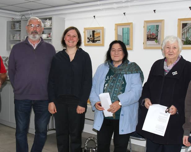 German artist Katja Striedelmeyer (2nd from left), meeting and greeting Seamus Barron, who she interviewed for this project, Agnes Gorman, Patricia Dillon and her granddaughter Laura Dillon, as they arrived in Kilcormac Community Centre for the official opening of the Peatlands exhibition. 