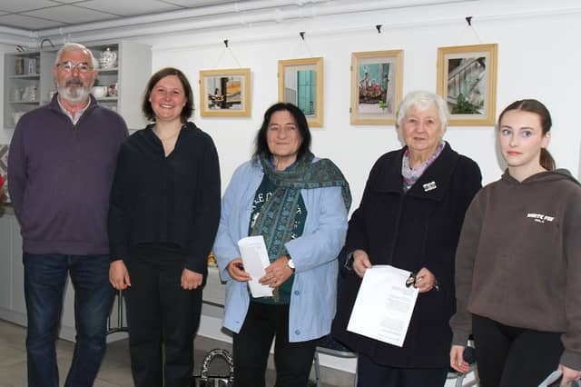 German artist Katja Striedelmeyer (2nd from left), meeting and greeting Seamus Barron, who she interviewed for this project, Agnes Gorman, Patricia Dillon and her granddaughter Laura Dillon, as they arrived in Kilcormac Community Centre for the official opening of the Peatlands exhibition.