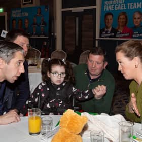 Tánaiste Simon Harris sought out Eimear Lynam at the end of the Budget Breakfast after she asked a question about help for parents of disabled children - Eimear (right) is pictured with husband Paul and daughter Kitty alongside John Clendennen TD
Pic: Niall O'Mara