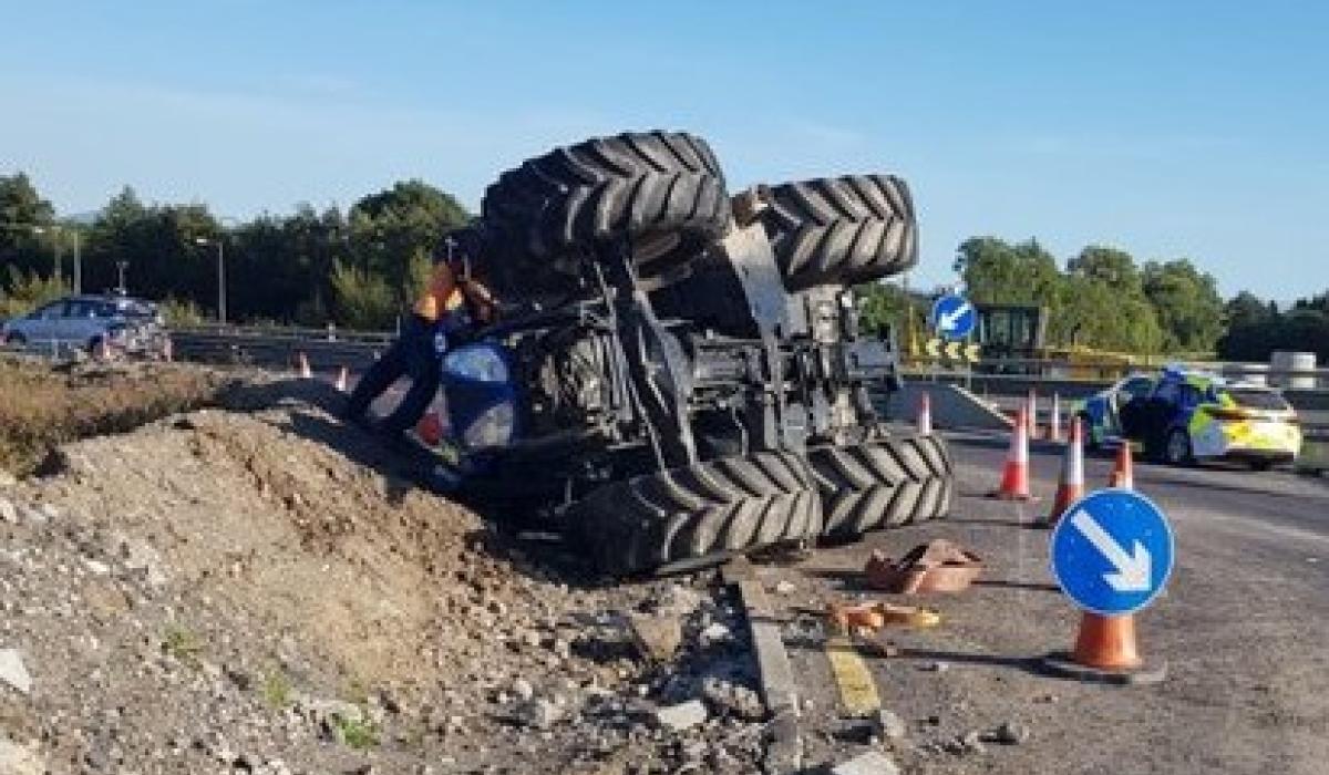 Tractor driver has lucky escape after toppling vehicle on motorway