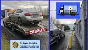Recovery truck in Midlands with car on board seized by gardai 