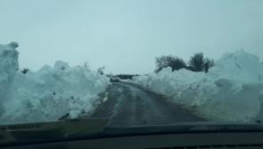 MUST WATCH: Just look at the massive walls of snow bordering this road