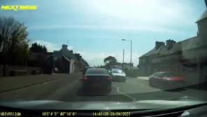 WATCH: Horrifying footage as 'joyrider' slams into two Garda vehicles and a building  