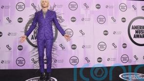 Machine Gun Kelly dons extravagant spiked suit at the AMAs