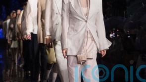 Pamela Anderson and Naomi Campbell walk the Miami runway for Hugo Boss
