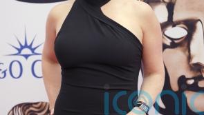 Kate Winslet leads trend for vampy black outfits at the Bafta TV awards